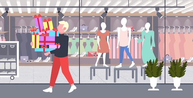 man carrying stack of wrapped gift boxes big seasonal sale shopping concept guy holding colorful presents modern boutique fashion shop exterior  full length horizontal