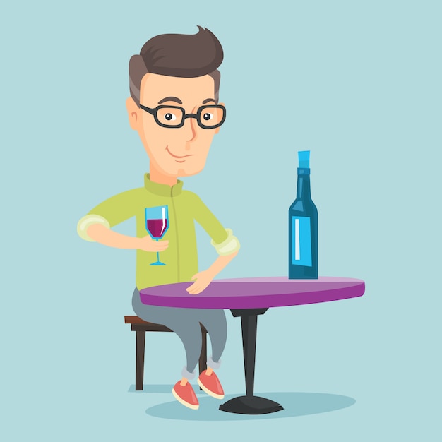 Man drinking wine at restaurant.