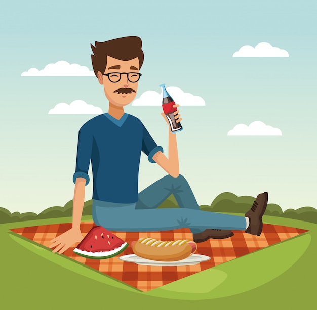 Man frisdrank drinken op picknick