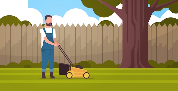 Man gardener cutting green grass with lawn mover farmer moving garden backyard gardening