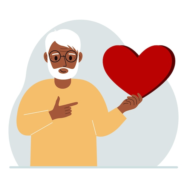 Un uomo tiene in mano un grande cuore rosso il concetto di volontariato relazione romantica o amore