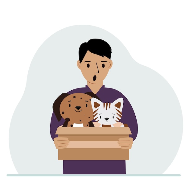 A man holds a cardboard box with a cat and a dog The concept of rescue help and care for pets