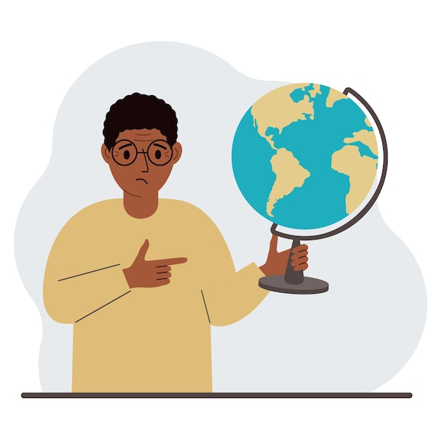 Un uomo tiene un globo in mano e punta il dito su di esso il concetto di educazione insegnante conquista mondiale ecologia vector flat illustration