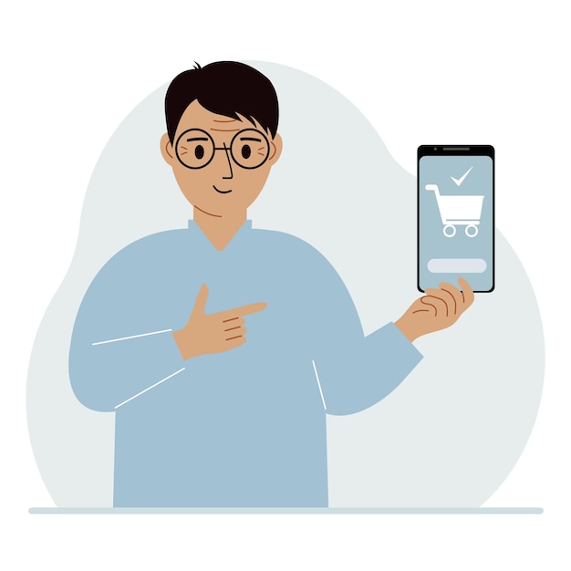 Мужчина держит в руке мобильный телефон с приложением для покупок в Интернете. В телефоне есть корзина для покупок.