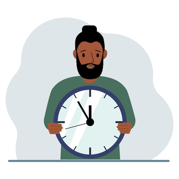 The man is holding a big clock in his hands Time management planning organization of working time effective business deadline