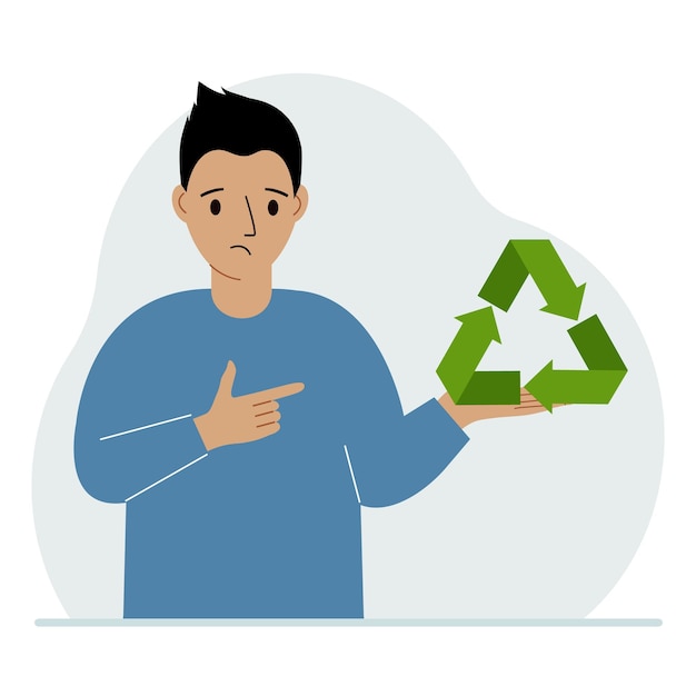 A man is holding a green recycle recycling or ecology sign in his hands