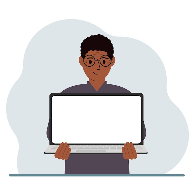 the man is holding a laptop with the screen facing away from him on the screen of the laptop there is a place for text laptop computer technology concept online education online work