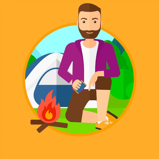 Man kindling campfire