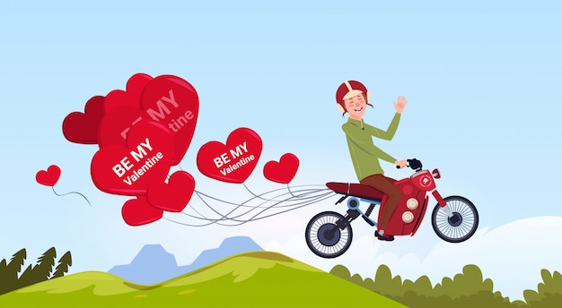 Man motor bike rijden met hartvormige lucht ballonnen happy valentines day concept