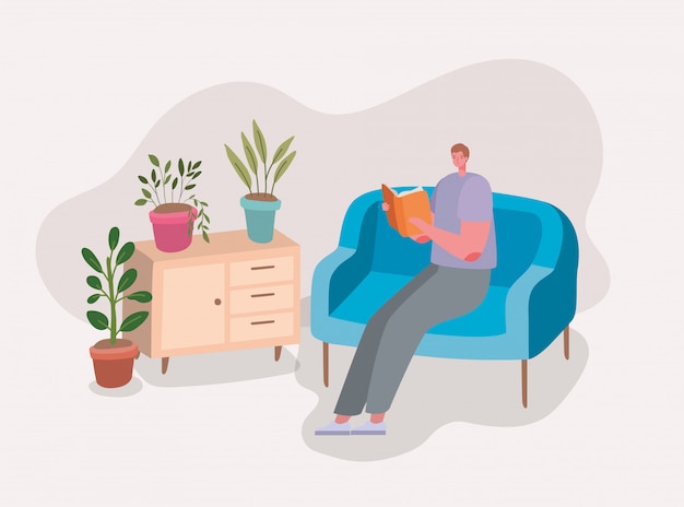 Man reading a book on couch