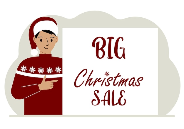 A man in a santa hat and an ugly sweater next to a Big Christmas Sale poster Christmas market