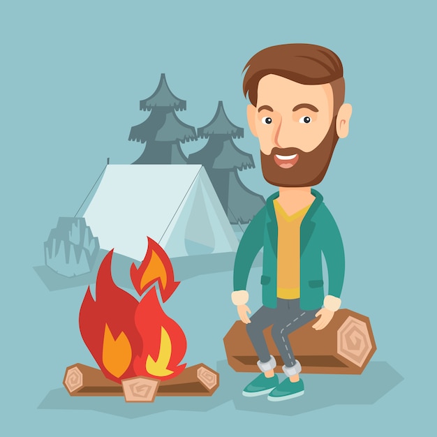 Man sitting on log near campfire in the camping.