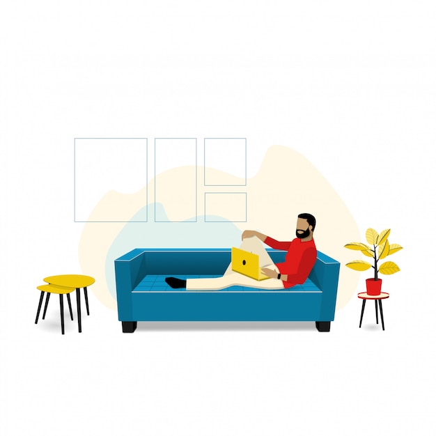 Man sitting on sofa at living room. relax or working on comfortable couch on evening or weekend at home.