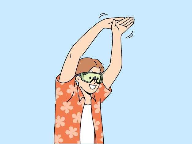 Man tourist stands in pose of swimmer wanting to dive into pool or sea during summer vacation Young happy guy in goggles for swimming and summer shirt getting ready to jump in sea water