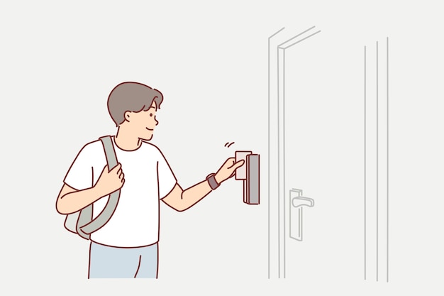 Man uses key card to open door to hotel room or hostel during tourist trip or business trip Guy with key card opens electronic lock gaining access to back office for company employees