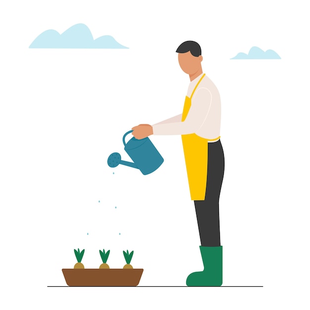 Man waters the seedlings of flowers from a watering can Gardening and hobbies