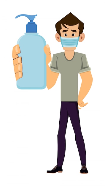 L'uomo indossa la maschera e mostra la bottiglia disinfettante per le mani