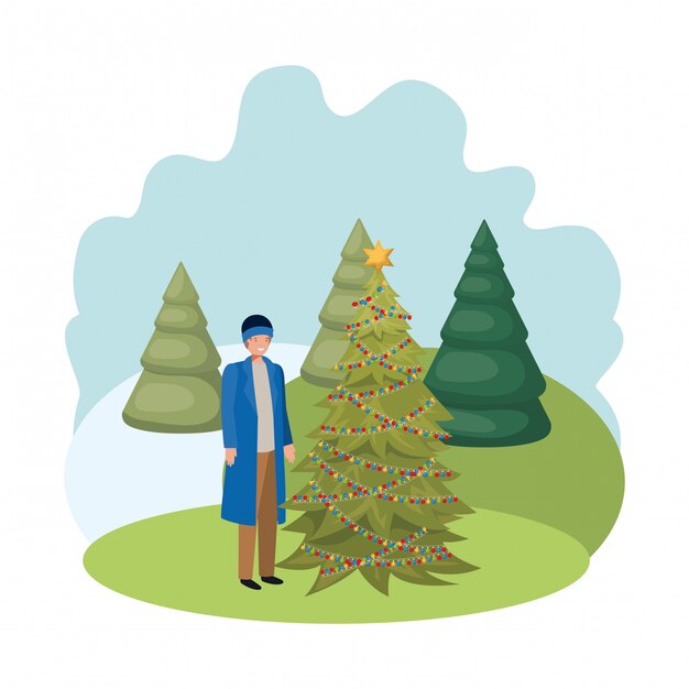 Man with christmas tree in landscape