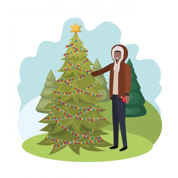 Man with christmas tree in landscape