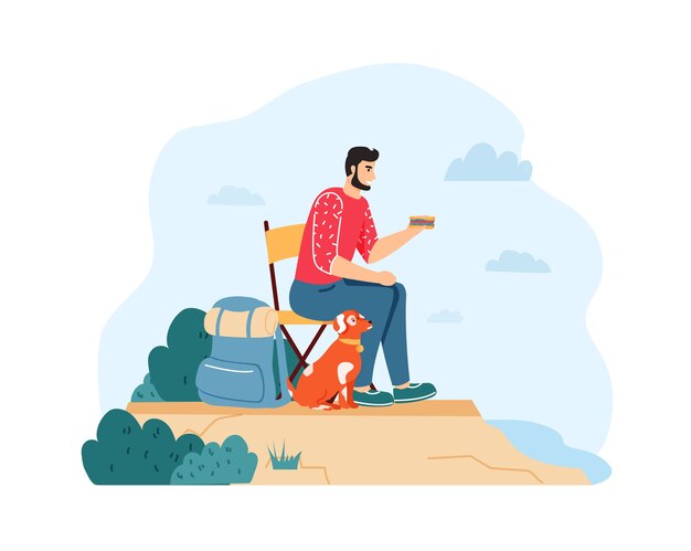 Man with dog hiking and having summer trip. guy sitting on chair and eating sandwich near backpack on cliff with pet.