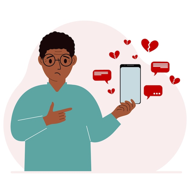 a man with a smartphone in his hand the concept of correspondence communication social networks lots of broken hearts