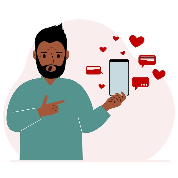 A man with a smartphone in his hand The concept of correspondence communication social networks Lots of hearts