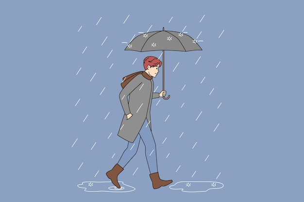 Man with umbrella walking in rain