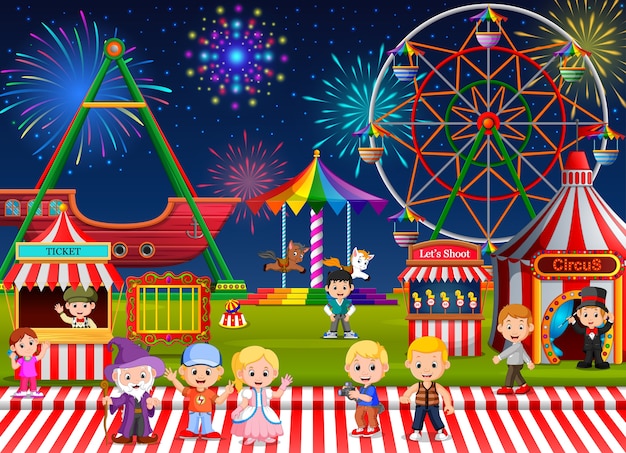 Many childrens and people worker having fun in amusement park at night