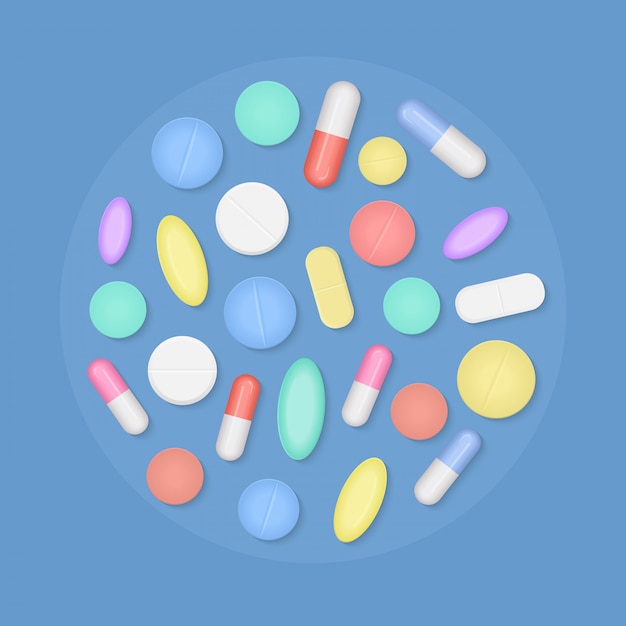 Many colorful medicine pills top view isolated.