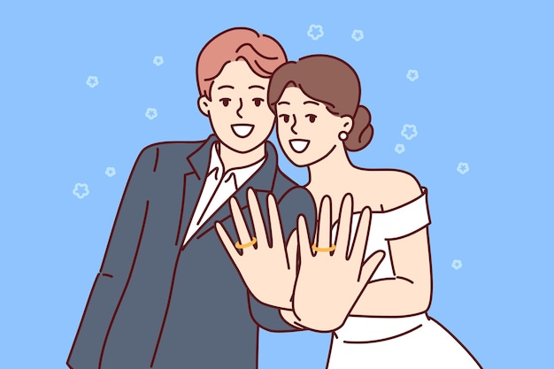 marriage ceremony of man and woman with wide smile showing wedding rings on fingers