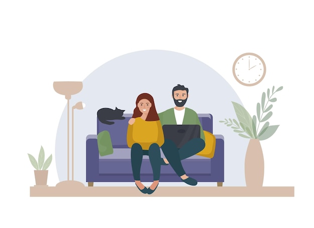 A married couple with a laptop sits at home on the sofa Work at home online education