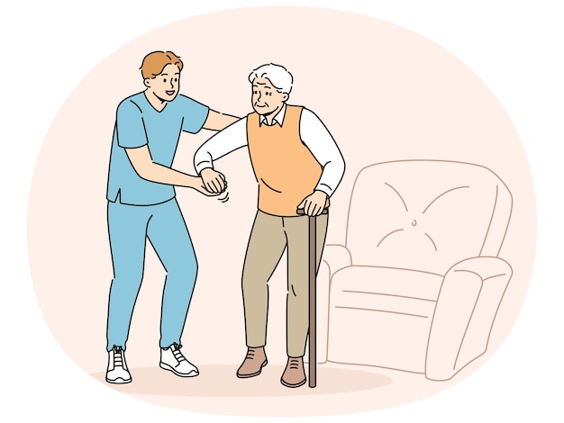 medical worker helps sick pensioner get out of his chair and walk around room or go outside