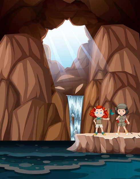 Vector meisjes die een grot met waterval verkennen