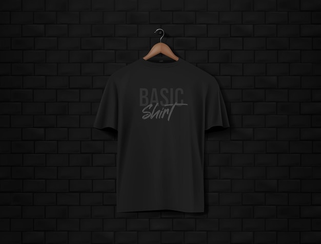 Mens black short sleeve tshirt mockup in black wall surface with dark bricks front view