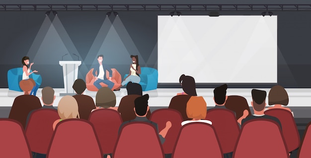 mensen uit het bedrijfsleven zittend op zitzakken toespraak houden op conferentie