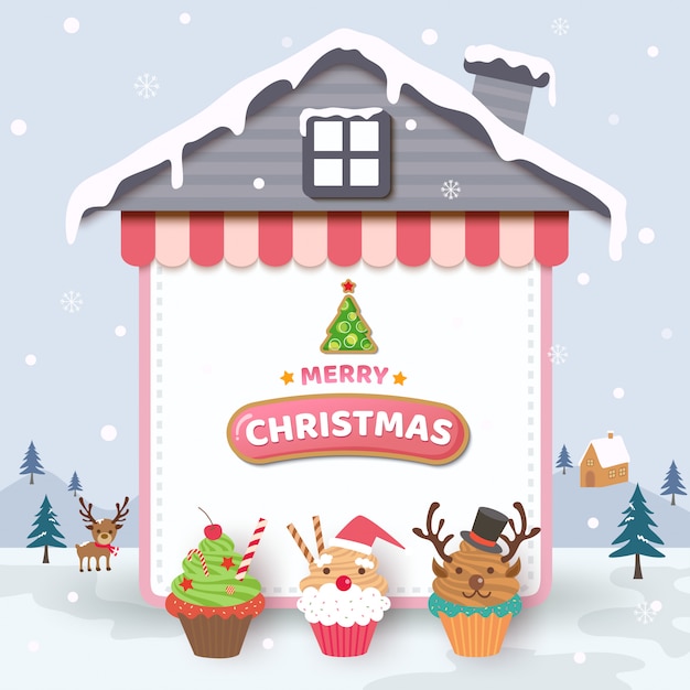 家のフレームと雪の背景にカップケーキとメリークリスマス。