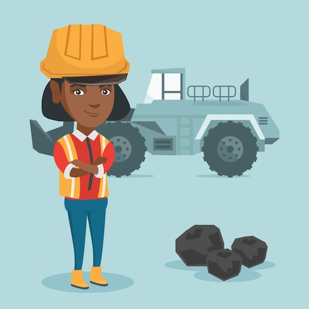 Miner standing with an excavator.