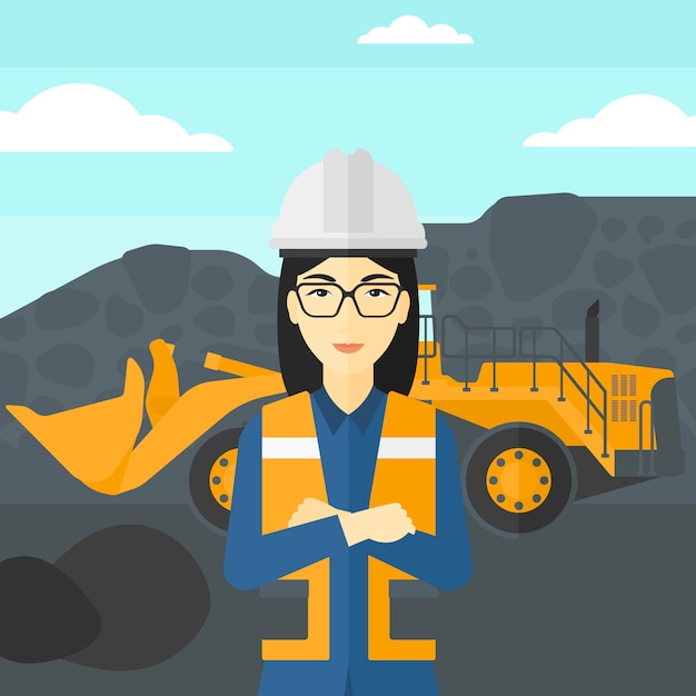 Miner with mining equipment on background.