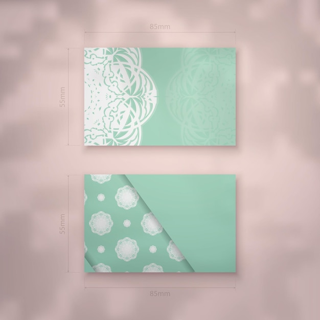 Mint colored business card with indian white ornaments for your business.