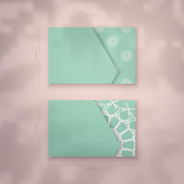 A mint colored business card with a luxurious white pattern for your brand.