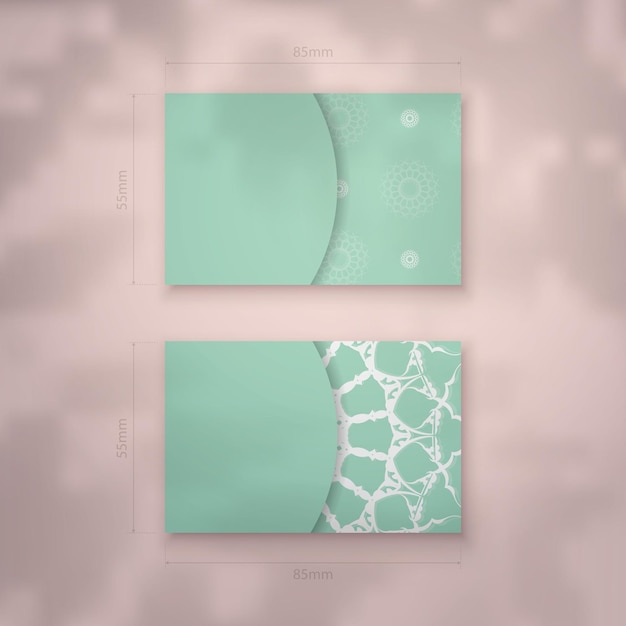 Vector mint colored business card with vintage white ornament for your contacts.