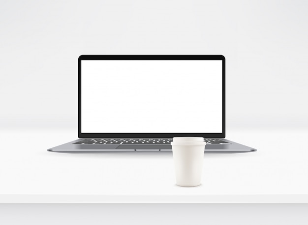 modern laptop with blank screen and coffee cup