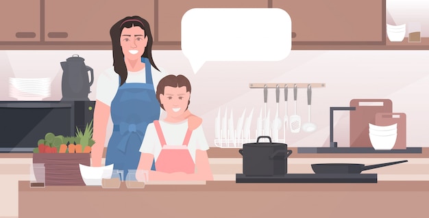 moeder met dochter bereiden van voedsel familie tijd samen doorbrengen concept moderne keuken interieur