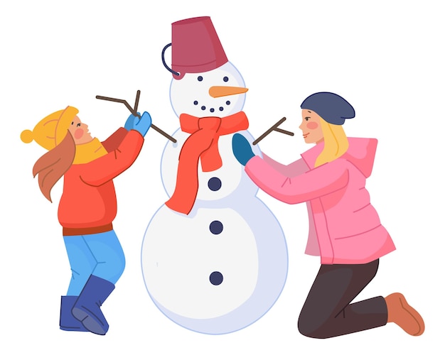 Mom and daughter making snowman Winter family activity