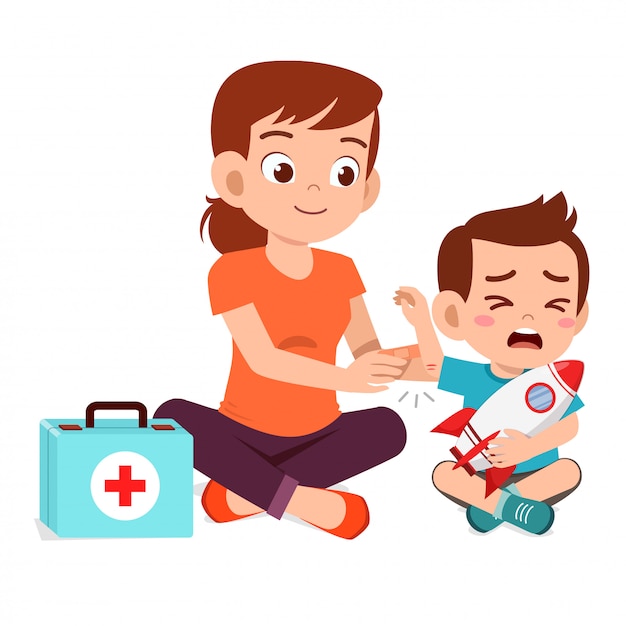 Mom help first aid to little kid boy