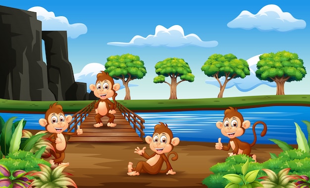 Monkeys cartoon hanging out on the wooden bridge