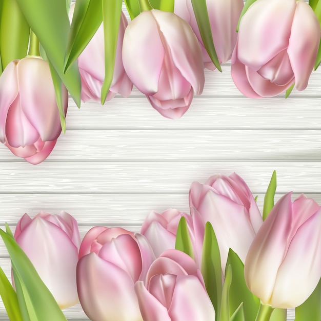 Mooie roze tulpen op houten achtergrond.