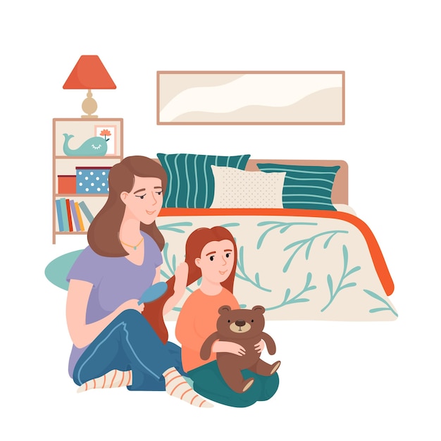 Mother combing hair of her little daughter with a brush, both sitting on the floor in bedroom with bed, shelf stand, lamp and picture on the wall, happy motherhood