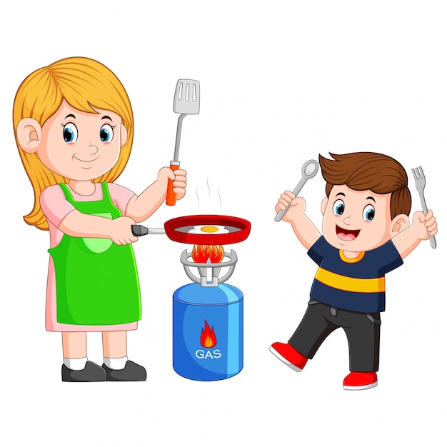 Mother and her son cooking egg with a frying