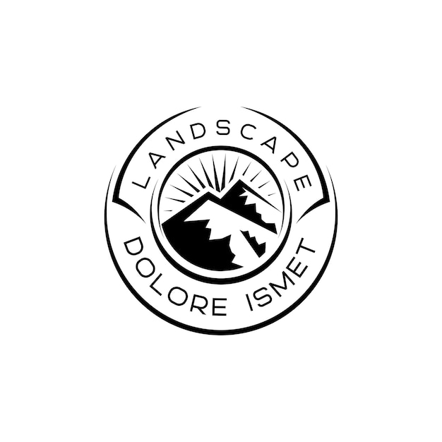 エンブレムサークルとビンテージスタイルの山の風景のロゴ